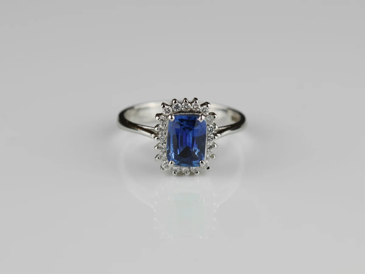 Cushion Cut Sapphire & Diamond Halo Ring in 18ct White Gold