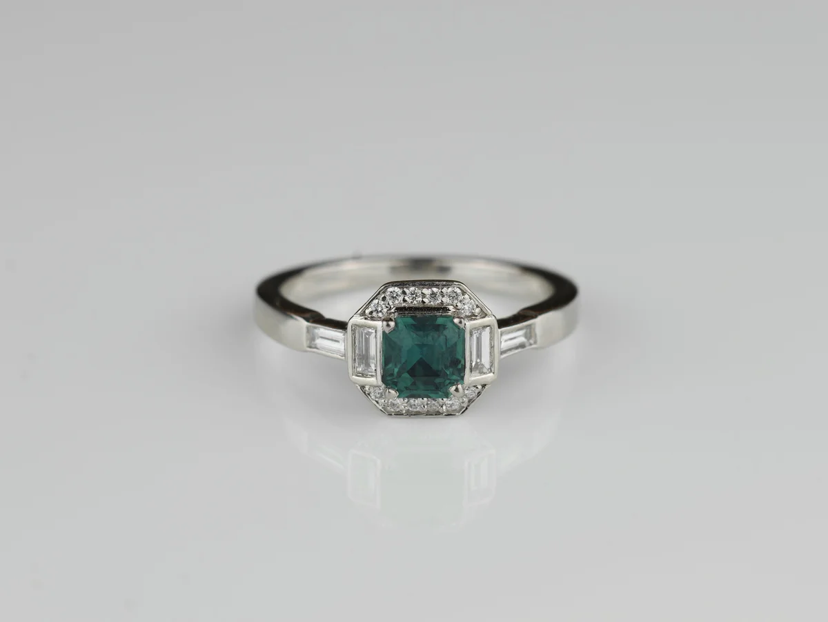 Teal Sapphire & Diamond Halo Ring in Platinum