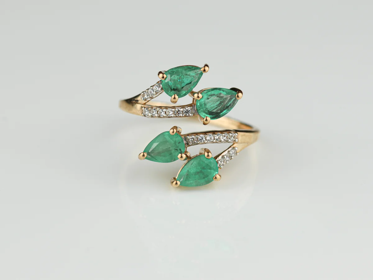 Emerald Cross Over Ring in 9ct Yellow Gold