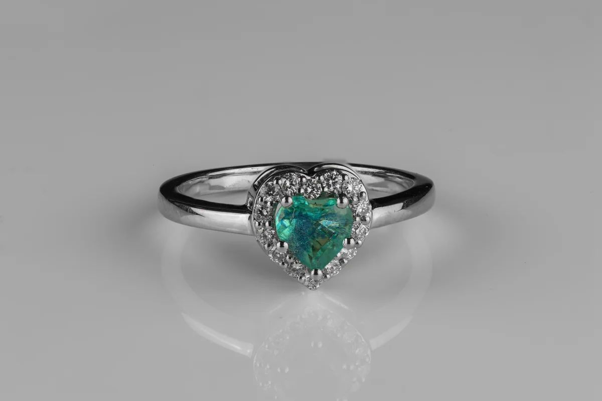 Teal Sapphire Halo Ring in Platinum
