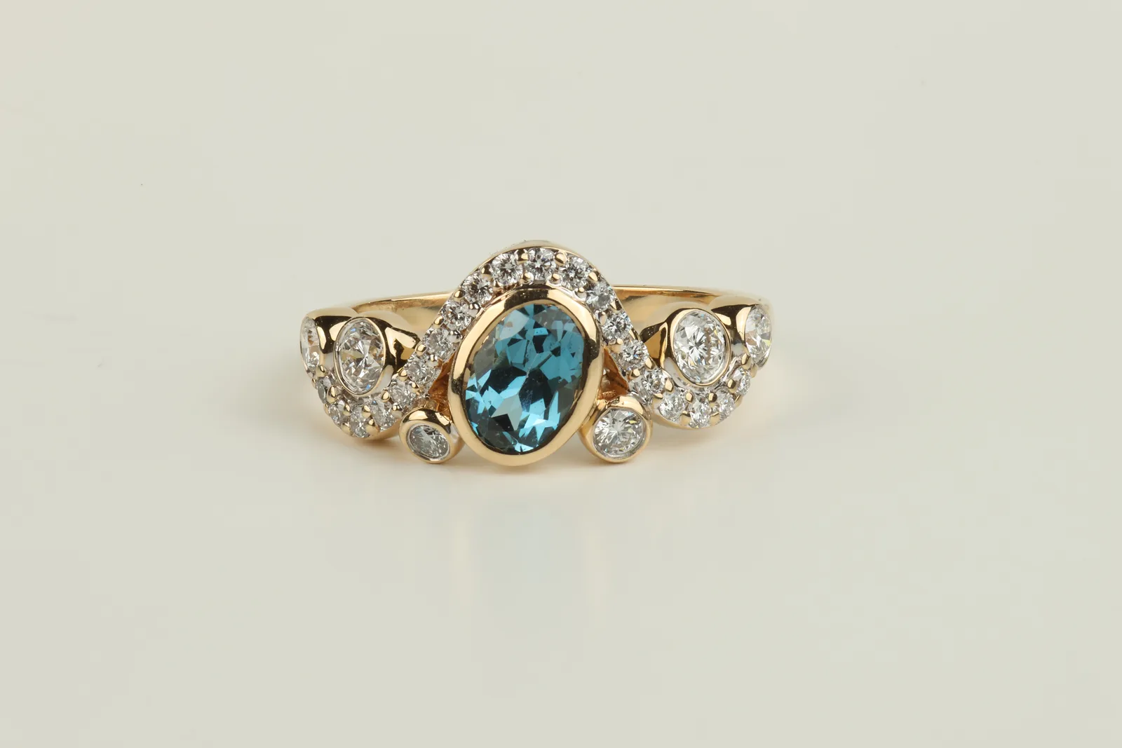 Blue Zircon Shoulder Set Ring in 18ct Yellow Gold